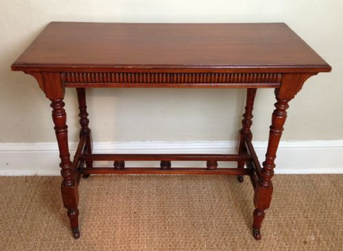 An Aesthetic Movement Walnut Table by James Shoolbred C 1890