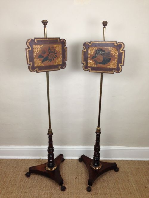 A Pair of Regency Rosewood and Painted Pole Screens Dated 1820