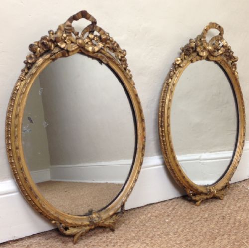 A Pair of Victorian Water Gilt Oval Mirrors C 1880