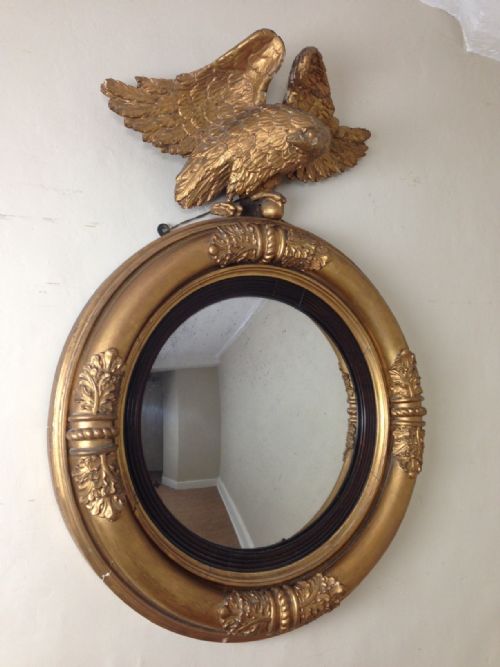 A Regency Gilt Wood Convex Mirror  with Eagle Surmount C 1820