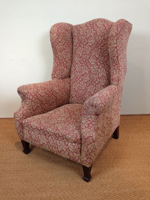 A Late Victorian Mahogany Wing Chair in the Style of Morris and Co  C 1900