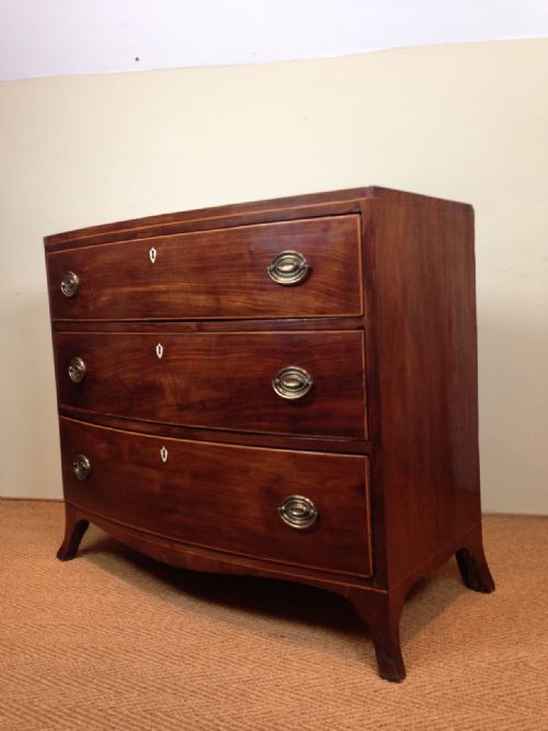fig 1. A George 111 mahogany bowfront chest of drawers c 1810