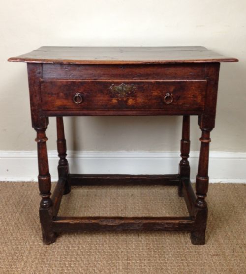 fig 1. A Queen Anne elm and walnut side table c 1710