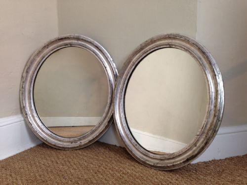 An Unusual Pair of Victorian Silvered Oval Mirrors C 1870