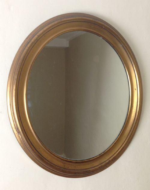 A Victorian Brass Oval Mirror