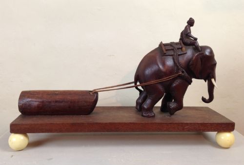 An Unusual Burmese Teak and Ivory Model of an Elephant Pulling a Log C 1930