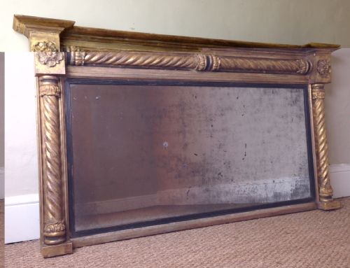 A Large Regency Gilt and Ebonised Over Mantel Mirror