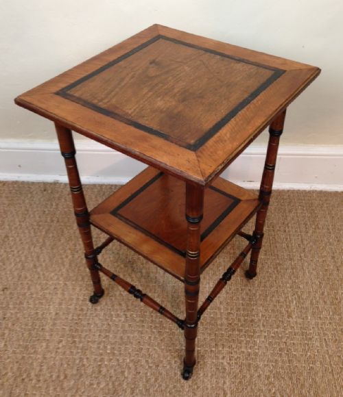 An Aesthetic Movement Walnut Ebony and Parcel Gilt 2 Tier Table C 1880