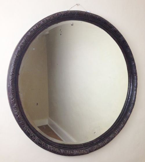 A Large Victorian Circular Carved and Ebonised Oak Mirror C 1880
