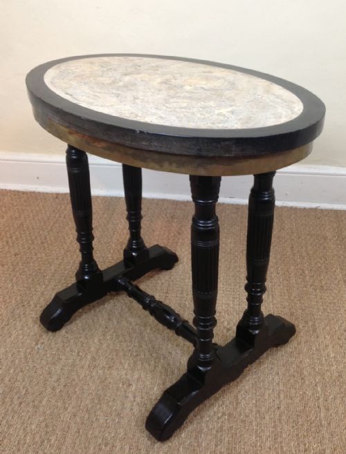 A Victorian Ebonised Marble and Slate Inset Oval Lamp Table C 1880 in Aesthetic Movement Style.

