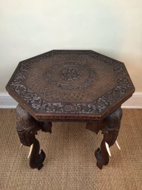 An Indian Carved Teak Octagonal Elephant Table. Bombay C 1910