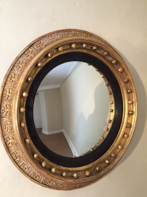 A Small Regency Giltwood Convex Mirror C 1820 of Unusual Design.