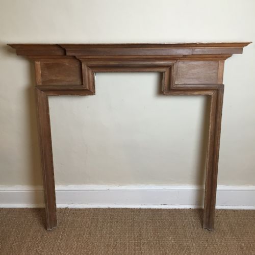 A Late 19th Century Beech and Pine Fireplace in the George II Style.