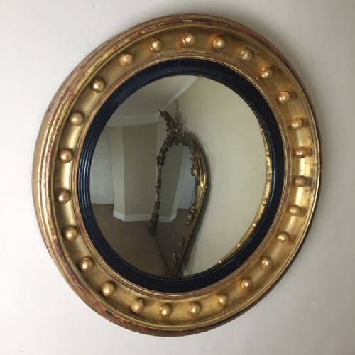 A George IV Gilt Wood Convex Mirror C 1830 with Original Plate and Reeded Slip.