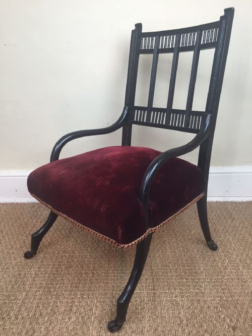 An Aesthetic Movement Ebonised Nursing Chair C 1880 in the Style of E W Godwin with the Original Velvet Seat.