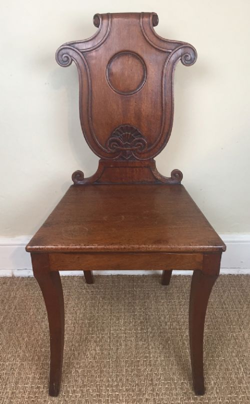 A Regency Mahogany Hall Chair C 1820 with Scrolled Back and Sabre Legs