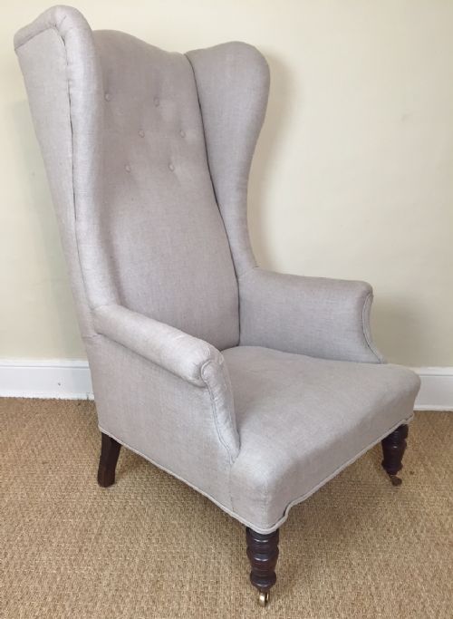 An Arts and Crafts's High Back Wing Armchair in the Style of Morris and Co