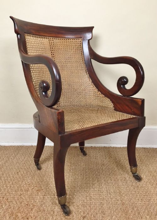 A Charles X Walnut Bergere Library or Desk Chair Circa 1830