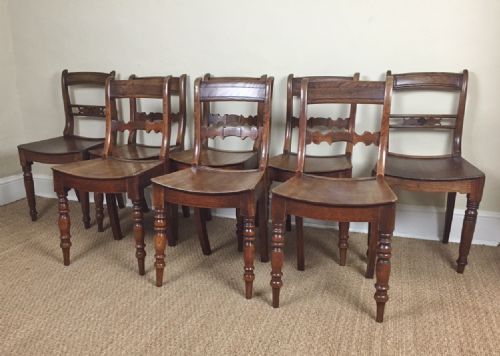 A Harlequin Set of 8 Late Georgian Elm Country Chairs Circa 1820