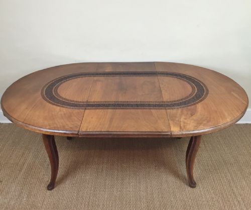 An Anglo Indian Walnut Extending Circular Dining Table by the Bombay Furniture Company Circa 1910