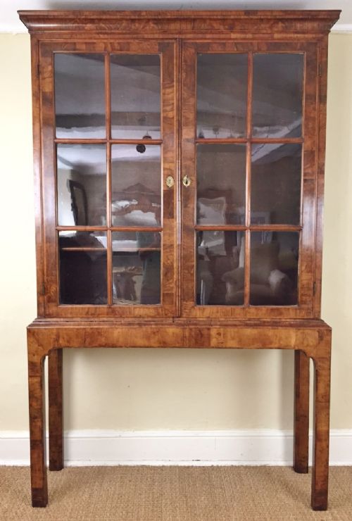A Rare George 1 Walnut and Feather Banded Cabinet on Stand Circa 1725.