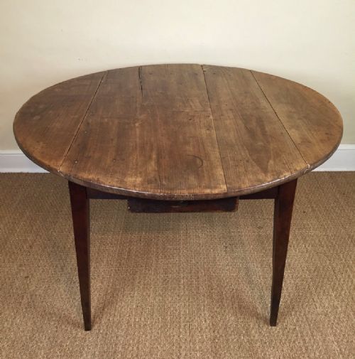 A French Circular Fruitwood Folding Table C 1860