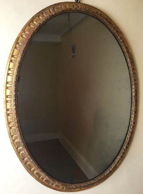 A George 111 Carved Wood Oval Gilt Mirror C 1770