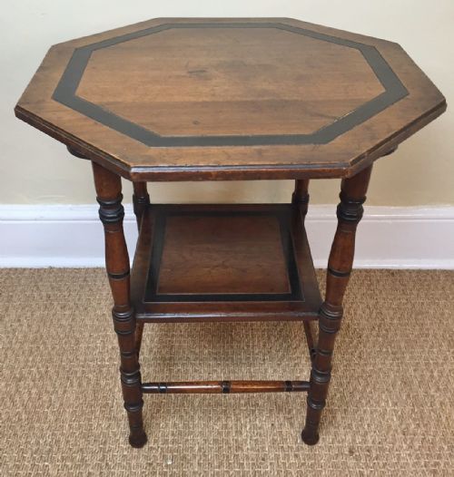 An Aesthetic Movement Walnut Ebonised and Parcel Gilt Octagonal Table After a Design by E W Godwin Circa 1880