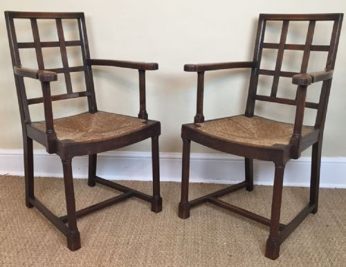 A Pair of Heals Oak Lattice Back Armchairs Circa 1910