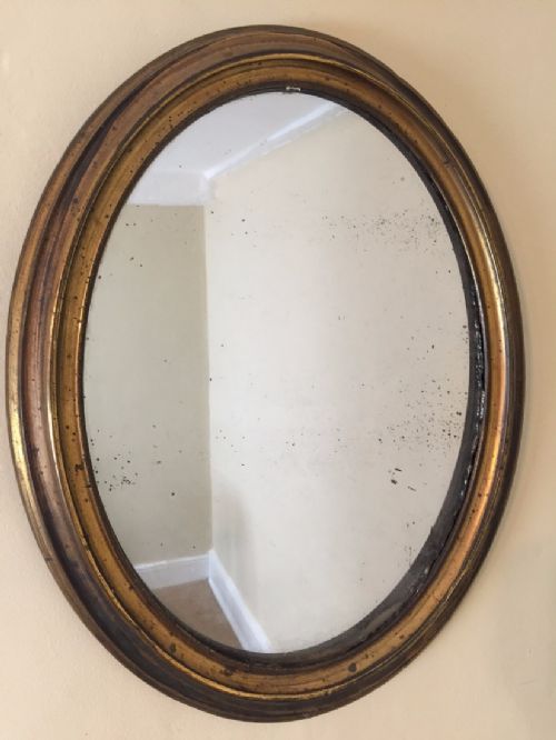A Mid 19th C Gilt Brass Oval Mirror