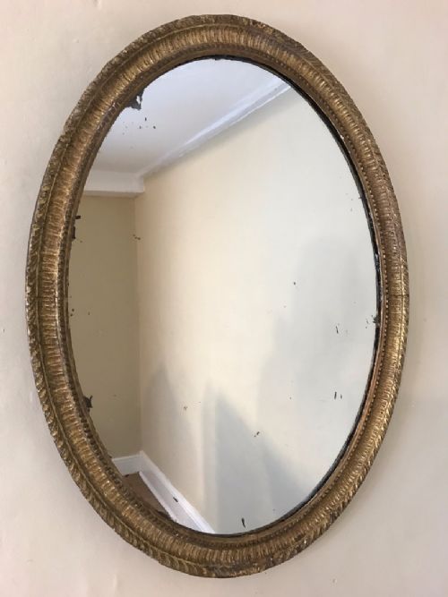 An Adam Period Giltwood Oval Mirror Circa 1790.