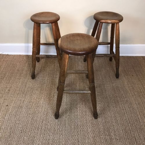 A Set of Three English Cotswold School Oak Bar Stools Circa 1920
