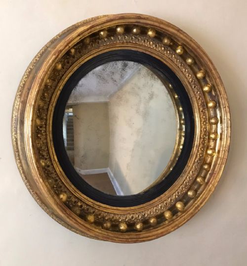 An Unusually Deep Regency Gilt Convex Mirror Circa 1815