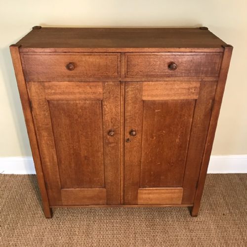 A Heals Oak Linen Cupboard Circa 1925.