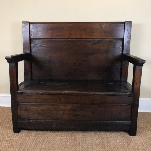 An Early 19th Century Somerset Ash and Elm Box Settle.
