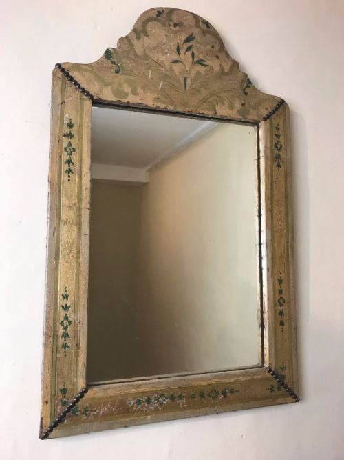 An Arts and Crafts Leather and Gilt Arched Mirror Circa 1900.