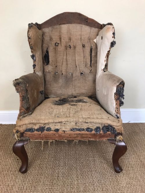 A Late Victorian Mahogany Leg Wing Armchair Circa 1890 for Re Upholstery.