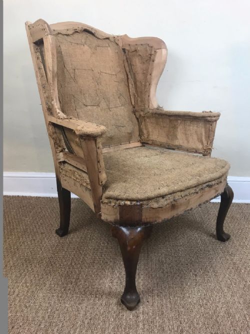 A Late Victorian Walnut Wing Armchair Circa 1900 in George 11 Style