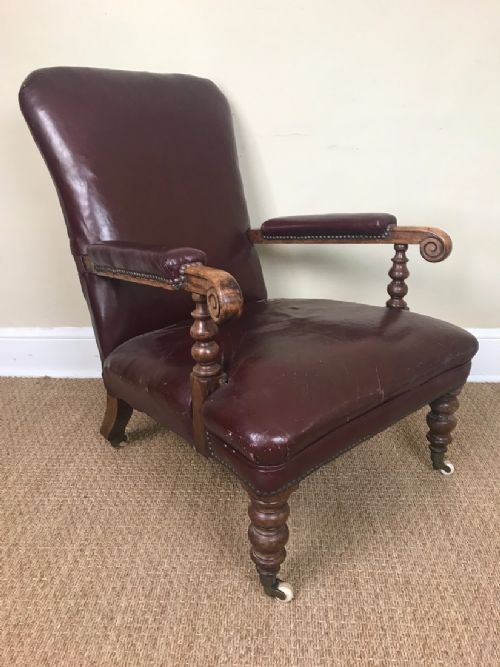 An Early Victorian Walnut and Leather Library Chair Circa 1860