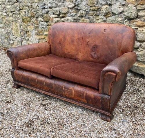 A Leather and Oak 2 Seater Sofa Circa 1925