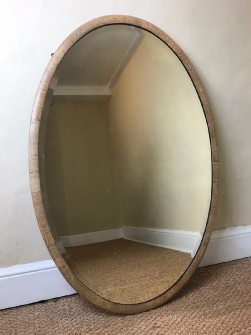 A Large Edwardian Pale Oak Oval Mirror Circa 1910