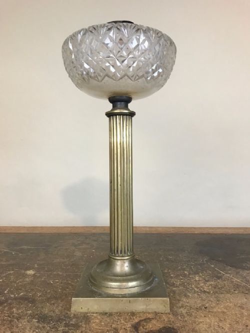 A Victorian Brass Oil Lamp Circa 1860 with Cut Glass Reservoir Bowl.