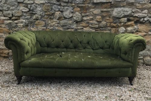 A Large Victorian Mahogany Chesterfield Circa 1880 on Turned Legs Brass Cappings and Casters.