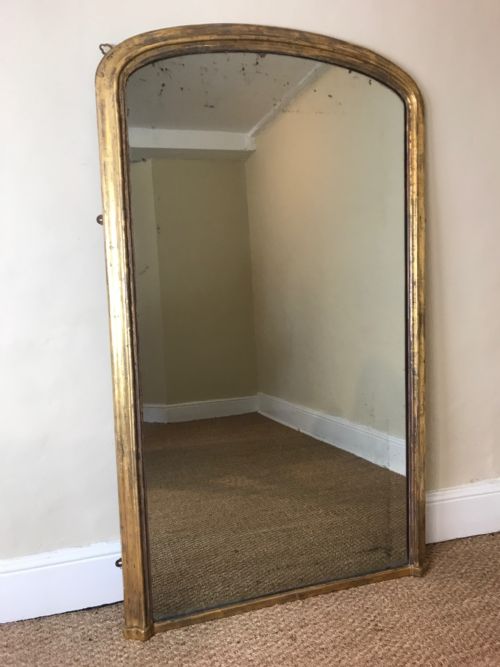 A Victorian Arched Gilt Mirror Circa 1860 with Original Plate and Water Gilding. 
