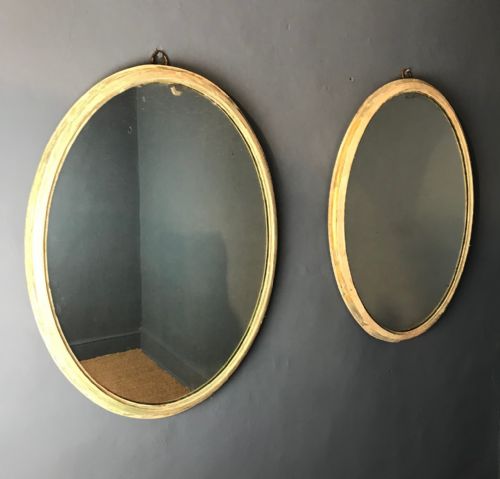 A Pair of George 111 Painted and Gilded Oval Mirrors Circa 1810