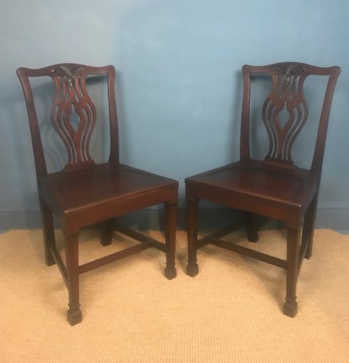 A Pair of Late 19th C Saddle Seated Hall Chairs Circa 1890 in the Chippendale Style