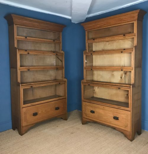 A Pair of Edwardian Golden Oak Glazed Waterfall Bookcases C 1910