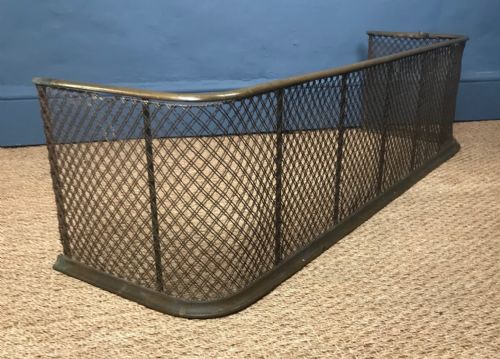 A Victorian Brass and Mesh Fire Fender Circa 1880 .