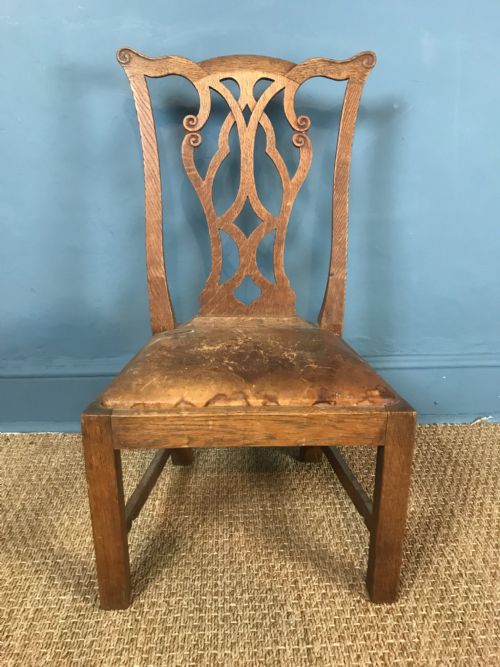A Scottish Oak Low Chair by Wheeler of Arncroach to a Design by Sir Robert Lorimer