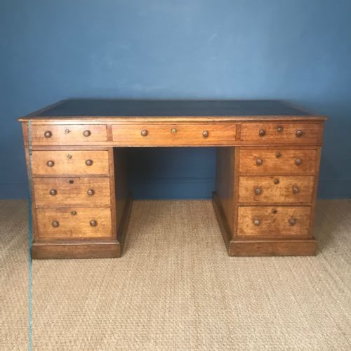 A Victorian Oak Pedestal Desk by Maples of London Circa 1890